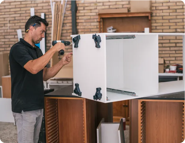 Expert cabinet carpenter completing a cabinet installation for a client